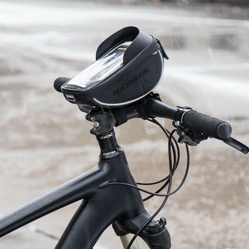 Waterproof ROCKBROS smartphone case on bicycle handlebars in rain