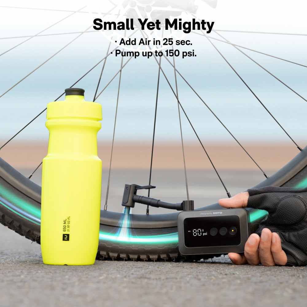 HOTO Air Pump Pocket inflating a bicycle tire with digital display